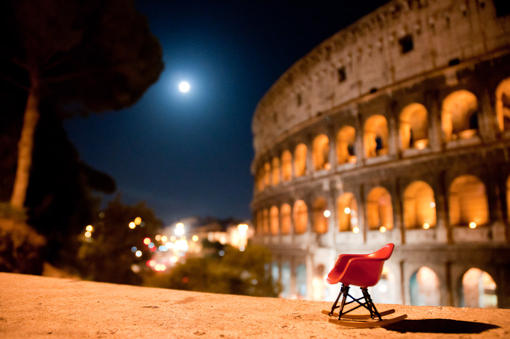Miniature Eames RAR rocker in front of the Colosseum, Rome, Italy